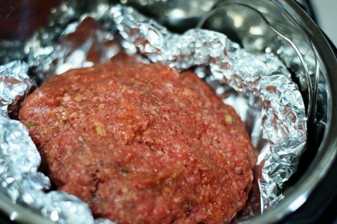 a closeup of this raw ground beef mixture for the instant pot meatloaf and potatoes recipe