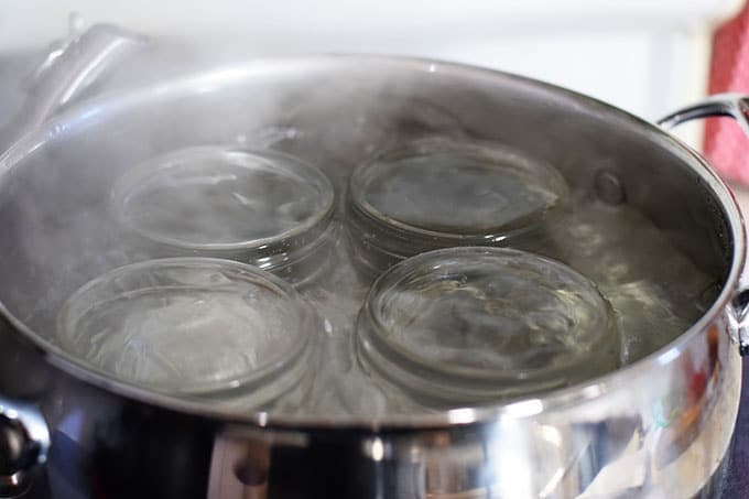 Mason Jars Boiling in Pot of Water to Sterilize 