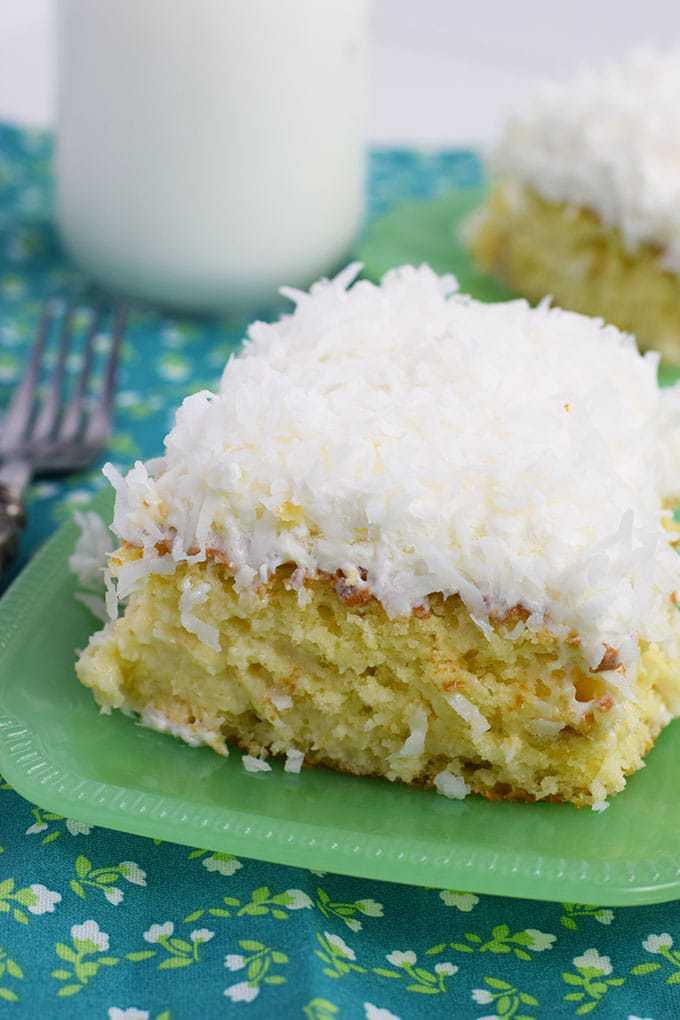 Coconut Cream Poke Cake on a green plate