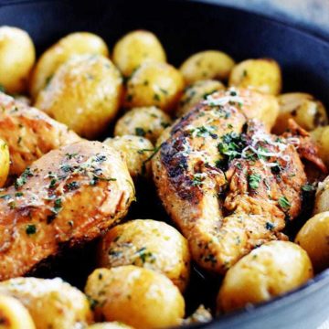 chicken breast cooked in a cast iron skillet with potatoes. Marinated in a lemon and herb dressing.