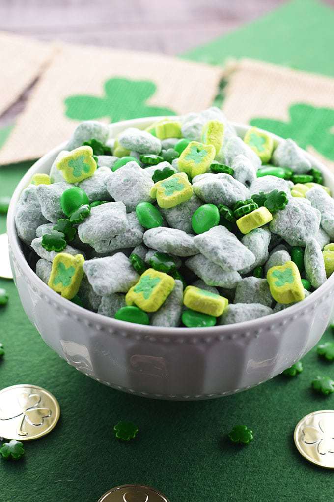 St Patrick's Day Lucky Chow - A bowl of Chex Cereal Tossed in a candy coating mixed with peanut butter and coated in powdered sugar