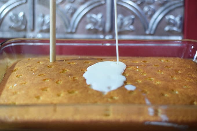 White Cake with Holes poked on top to pour coconut milk mixture on