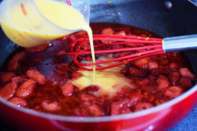 Sliced Strawberries with Orange Juice and Zest Cooking in Saucepan