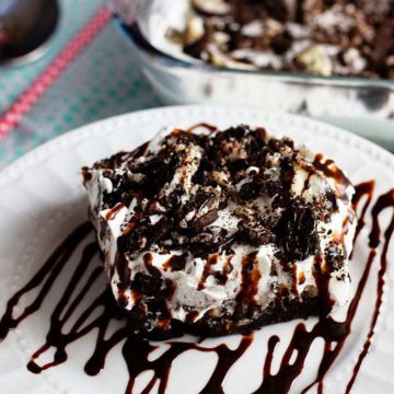 Oreo Brownie Poke Cake Drizzled with Chocolate