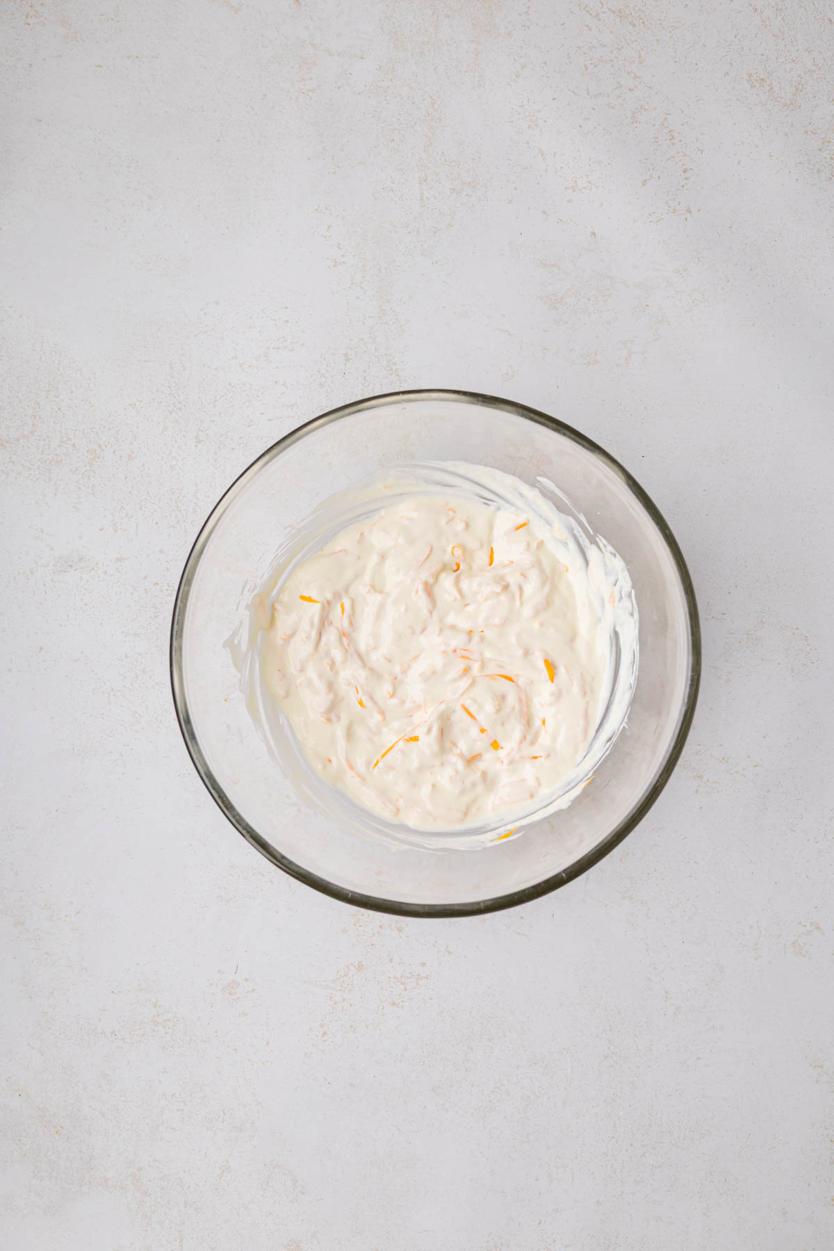 Sour cream and cheese mixture in a bowl.