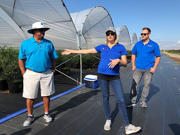 a group of people on a tour of the blueberries at Wish Farm