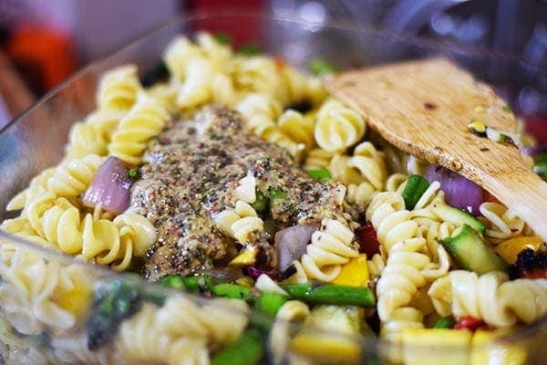 an closeup of the noodles, grilled vegetables, and dry seasonings used in this colorful grilled summer vegetable pasta salad recipe