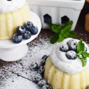 Mini Almond Bundt Cakes with Blueberry Whipped Cream Garnished with blueberries