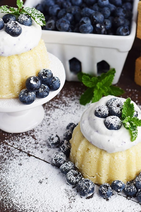 Mini Almond Bundt Cakes with Blueberry Whipped Cream Garnished with blueberries