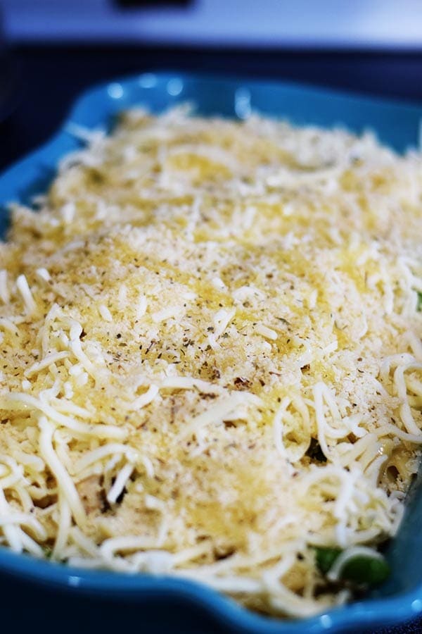 an overhead shot of this cheesy chicken asparagus bake before it is baked in the oven 