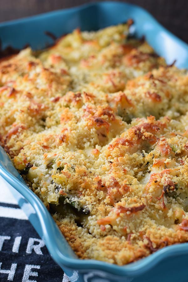 Baked Cheesy Chicken Asparagus Pasta in a blue baking dish