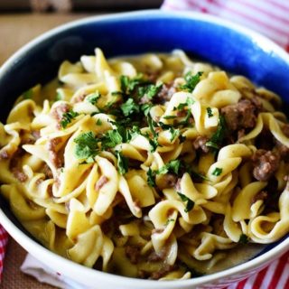 Instant Pot Creamy French Onion Ground Beef and Noodles in a blue bowl