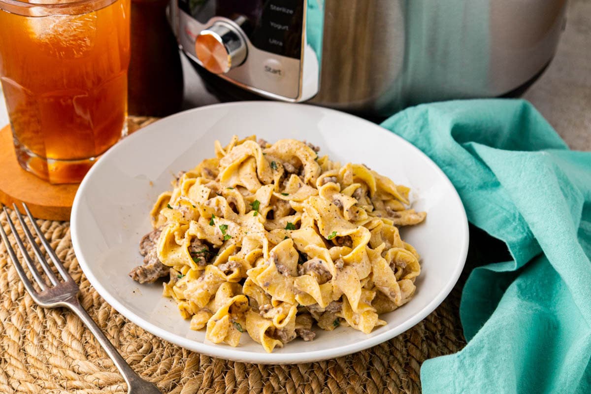 French onion, ground beef, and noodles made in the instant pot in a white bowl.