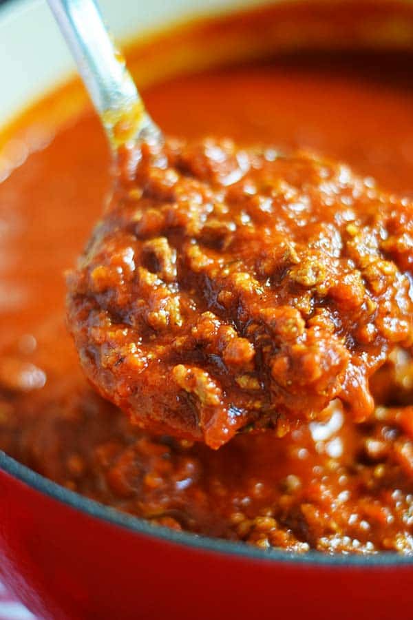 a closeup of a spoonful of crock pot spaghetti sauce for this kicked up spaghetti sauce from a jar recipe