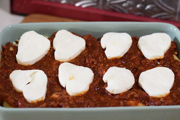 slices of fresh mozzarella placed on top of the layer of marinara sauce on these baked jumbo shells