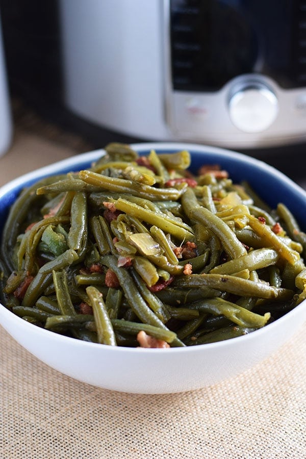 Instant Pot Southern Style Green Beans and Bacon in a white and blue bowl