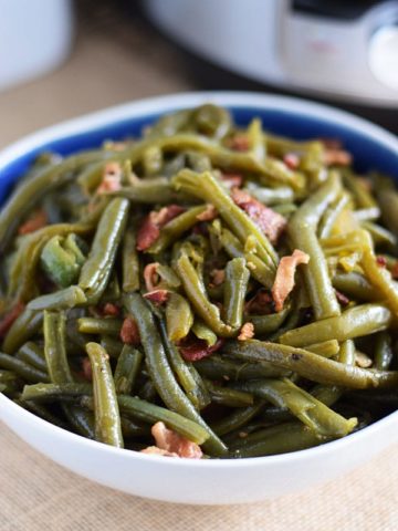 A closeup of pressure cooked southern green beans with bacon aka instant pot green beans