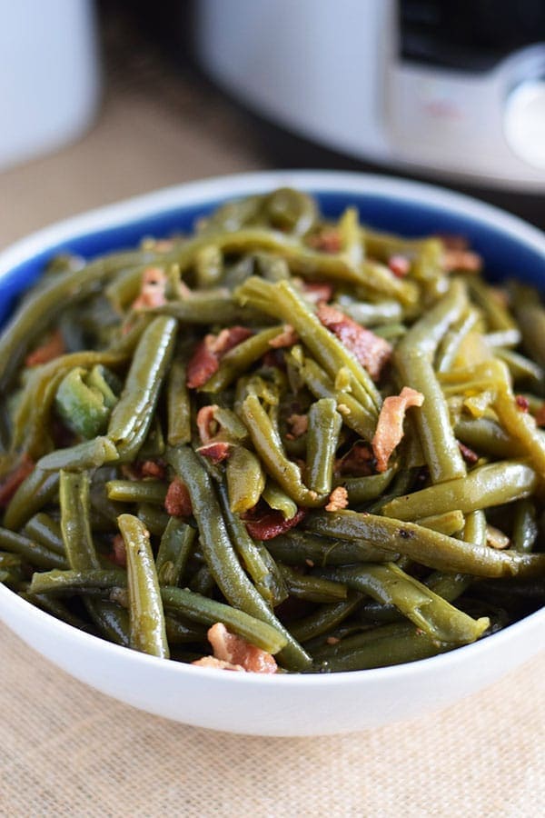 A closeup of pressure cooked southern green beans with bacon aka instant pot green beans