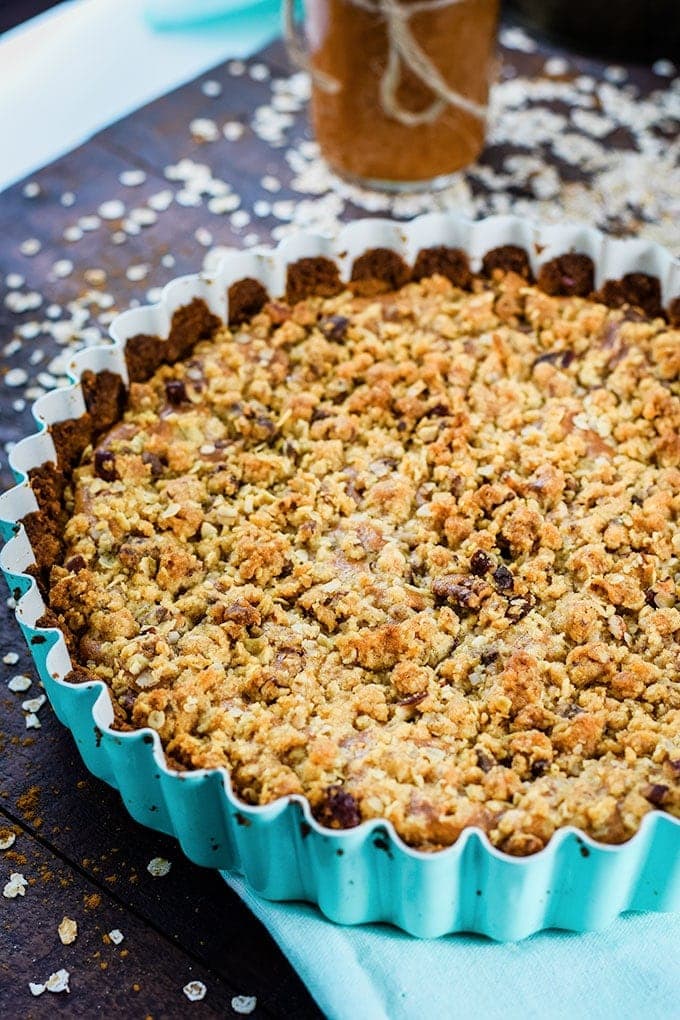 An overhead shot of this apple butter cheesecake tart with a streusel topping