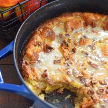 A pot of this bourbon apple pecan bread pudding recipe with a slice missing