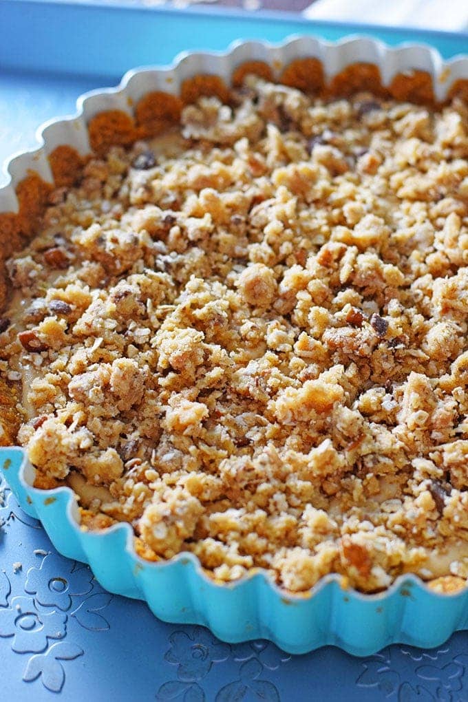 An overhead view of the cinnamon graham cracker crust for this apple butter cheesecake tart recipe