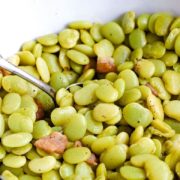 A white serving bowl filled with these southern-style baby lima beans