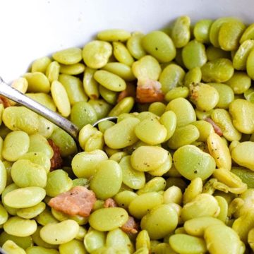 A white serving bowl filled with these southern-style baby lima beans