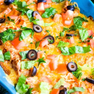 Ground Beef Doritos Casserole in a Blue Casserole Dish