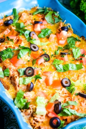 Ground Beef Doritos Casserole in a Blue Casserole Dish