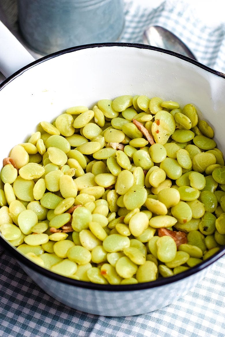 A ceramic cooking pot filled with these southern-style baby lime beans