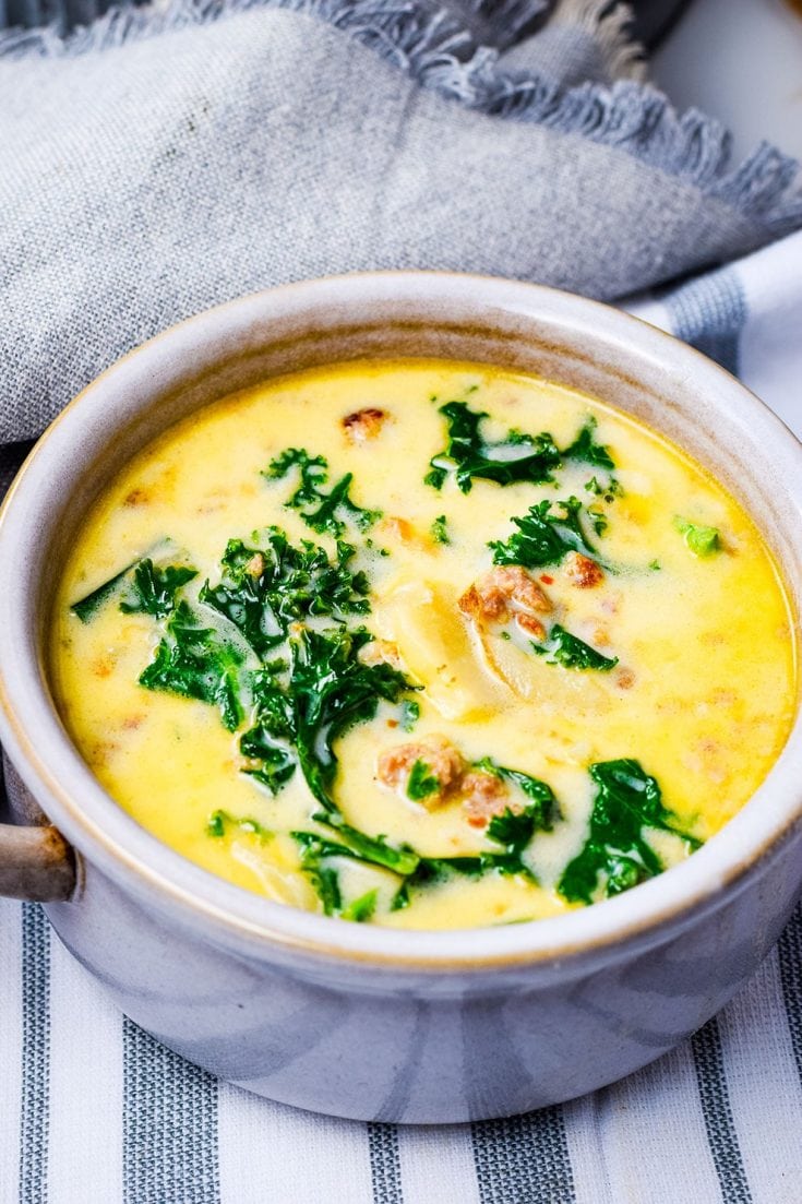a white bowl filled with this homemade Zuppa Toscana soup recipe with sausage and kale