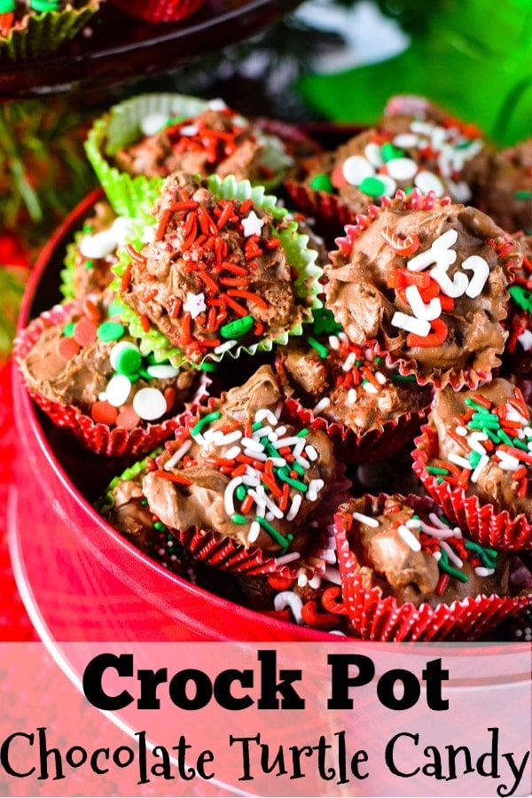 A close up of these homemade crock pot turtle candies garnished with red, white, and green sprinkles for Christmas