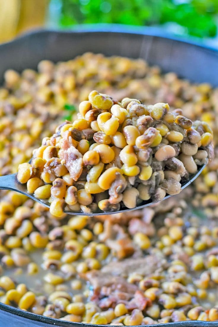 A closeup of a spoonful of this homemade black eyed peas 