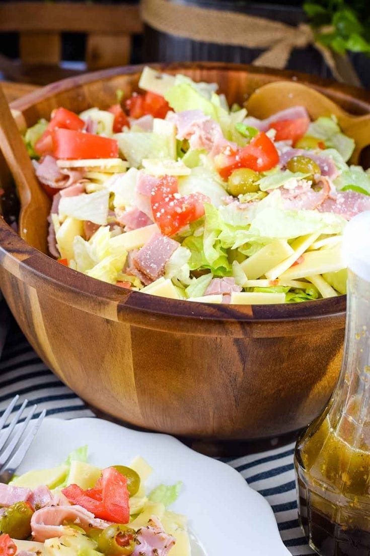 A large wooden serving bowl of this Columbia Restaurant\'s 1905 salad recipe