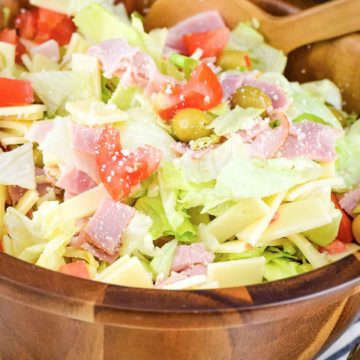 A large wooden serving bowl of this Columbia Restaurant's 1905 salad recipe