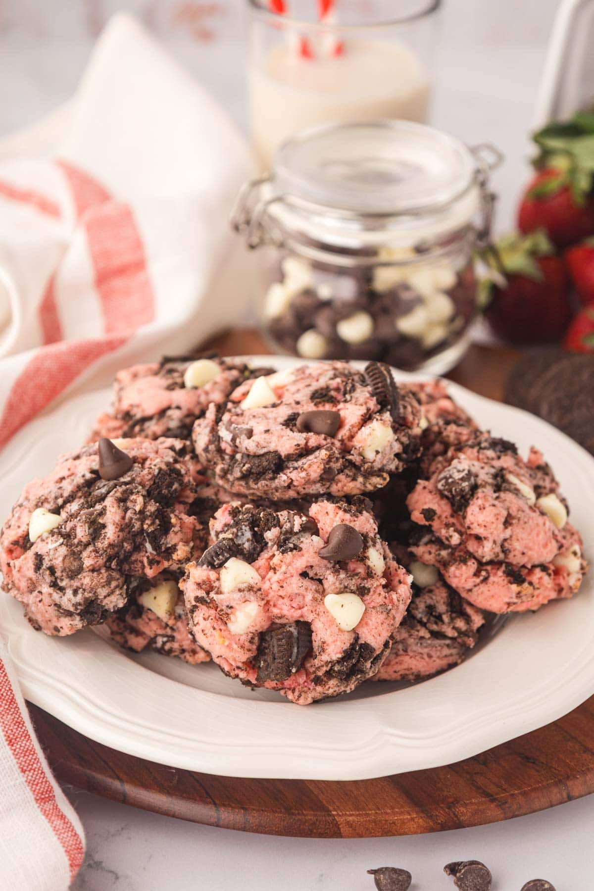 Strawberry Oreo cheesecake cookies on a white serving plate.