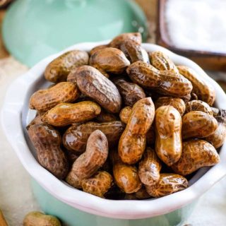 Boiled peanuts in a green bowl.