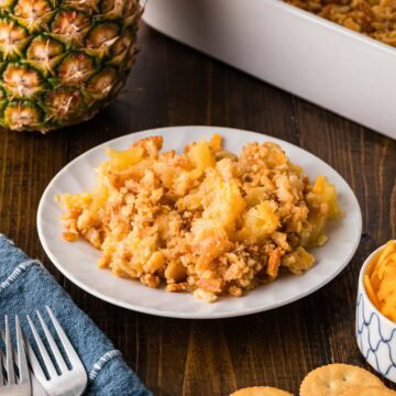A plate of a serving pineapple cheese casserole.