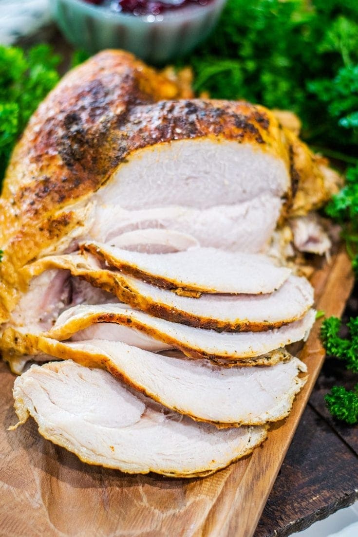 Sliced turkey breast on a serving platter.