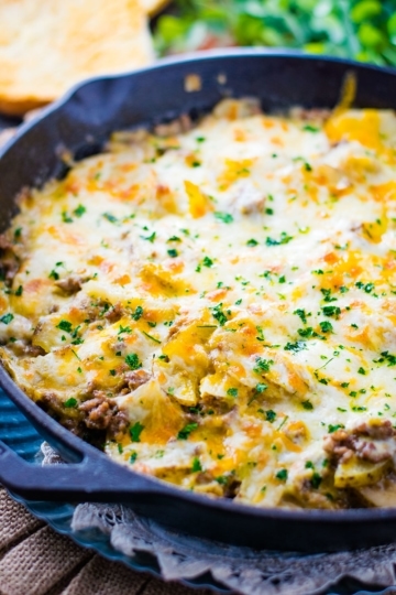 An overhead shot of this Easy Ground Beef and Potatoes Skillet garnished with fresh parsley