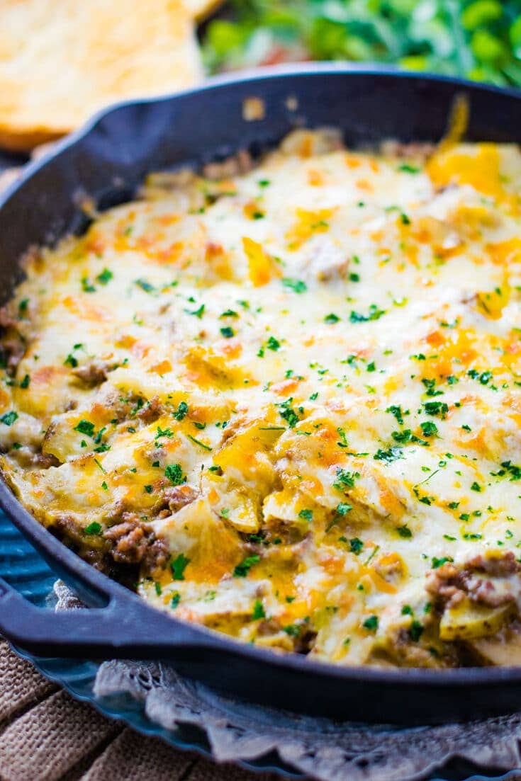 An overhead shot of this Easy Ground Beef and Potatoes Skillet garnished with fresh chopped parsley