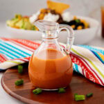 Homemade Catalina dressing in a salad dressing jar.