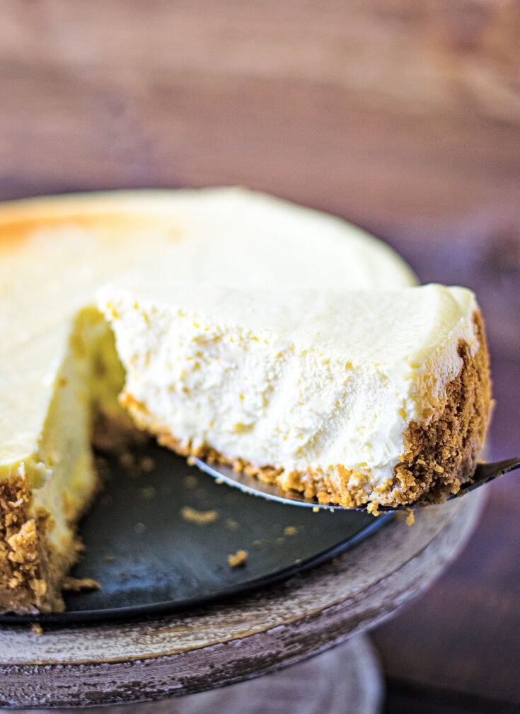 Classic Cheesecake Recipe on a cake pedestal 