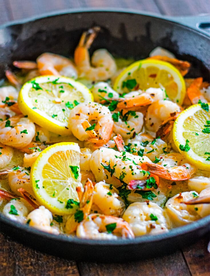 Garlic butter shrimp scampi cooked in a skillet with lemon and white wine