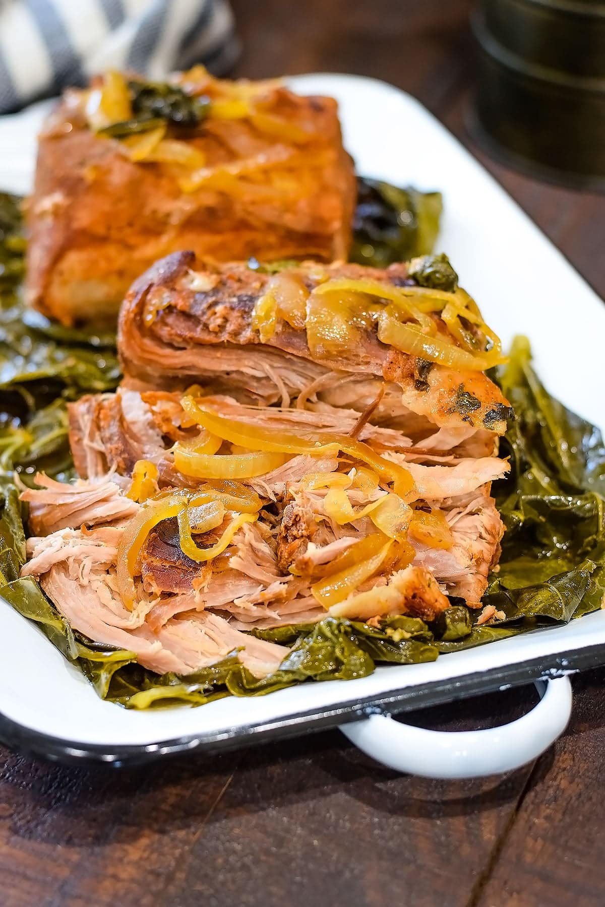 Pulled collard greens wrapped pork loin roast