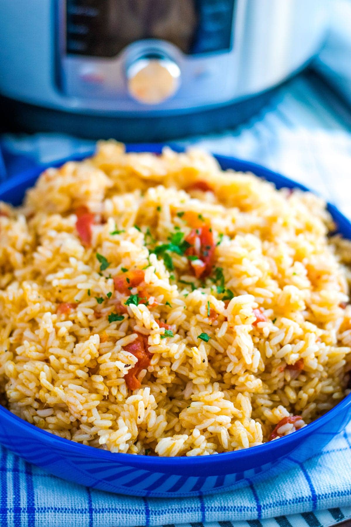 Instant Pot Tomatoes and Rice in a blue serving dish