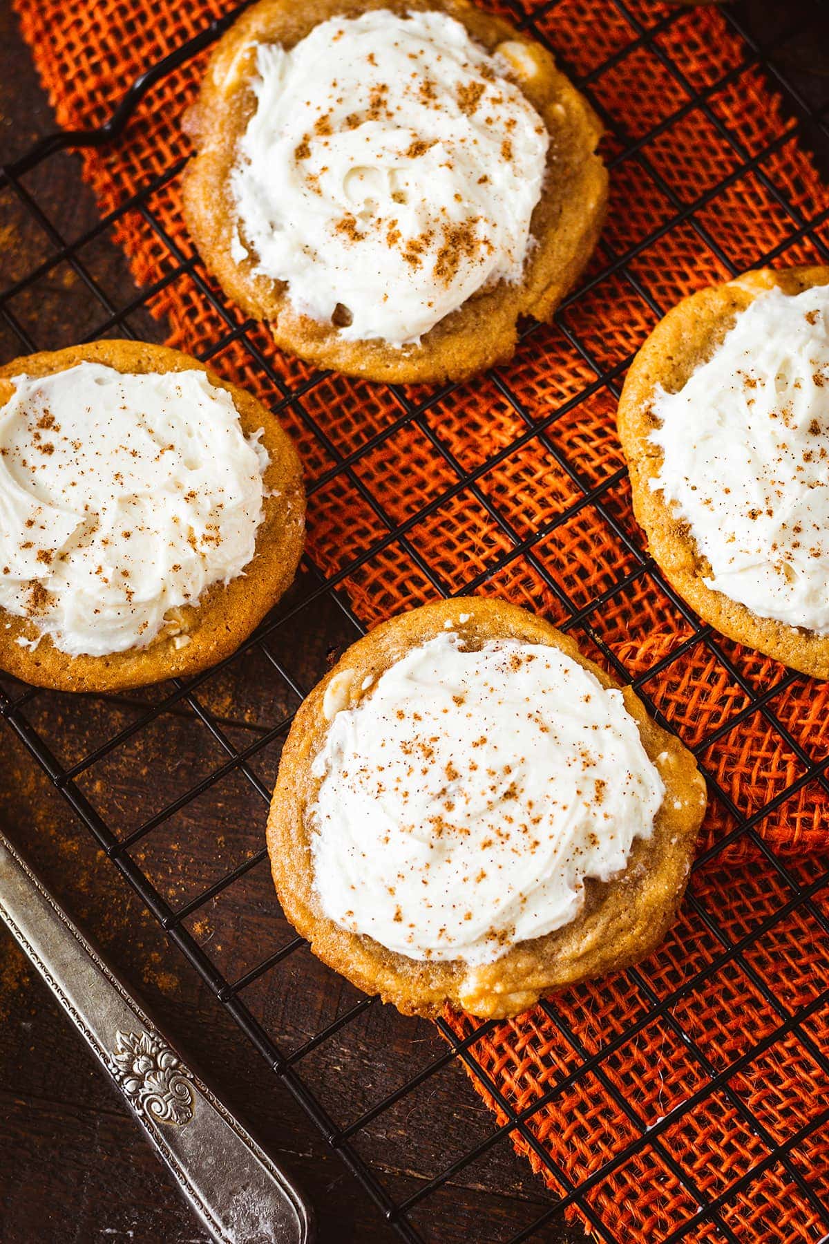 white chocolate caramel pumpkin spice cookies filled with buttercream icing 