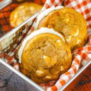 a closeup of these white chocolate caramel pumpkin spice sandwich cookie sandwiches