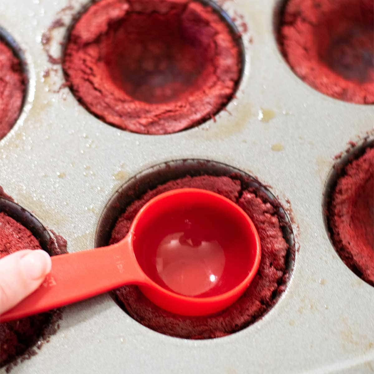 Brownie Cups out of oven. Press with measuring spoon back to create the cup.