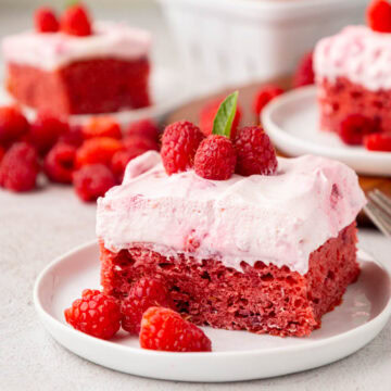 Slice of raspberry fluff cake garnished with mint